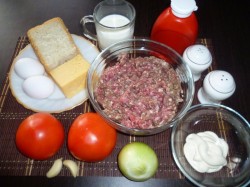 название картинки Котлеты в духовке с хлебом сыром и помидорами