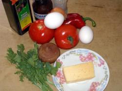название картинки Омлет с овощами и сыром на сковороде