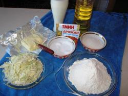 название картинки Пирожки из дрожжевого теста с капустой в духовке