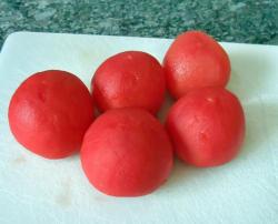 название картинки Тушеные помидоры с чесноком и луком